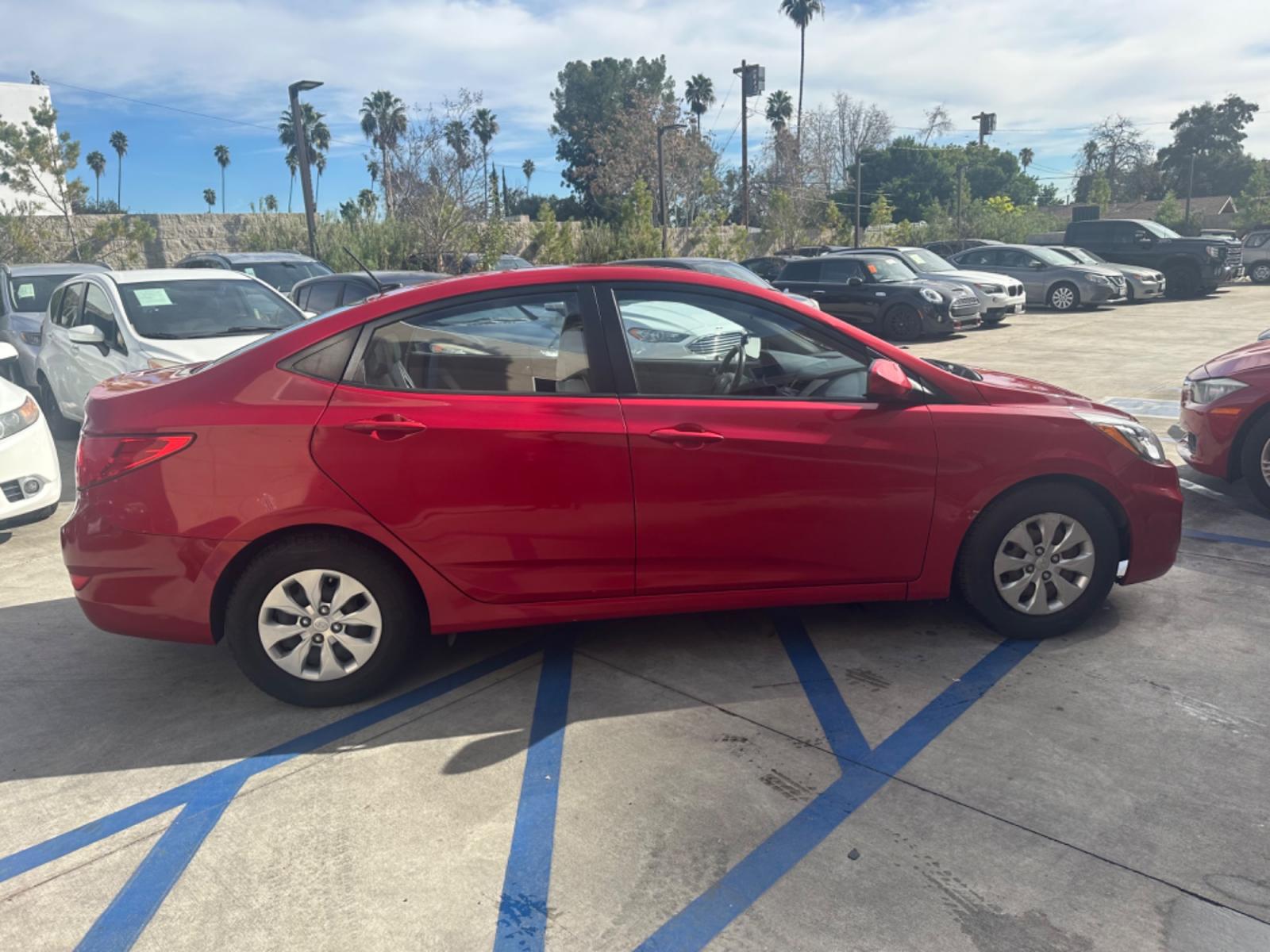 2015 Red /Gray Hyundai Accent GLS Sedan 4D (KMHCT4AE2FU) with an 4-Cyl, 1.6L engine, Auto, 6-Spd w/Overdrive transmission, located at 30 S. Berkeley Avenue, Pasadena, CA, 91107, (626) 248-7567, 34.145447, -118.109398 - The 2015 Hyundai Accent 4-Door Sedan stands as a testament to Hyundai's commitment to quality, efficiency, and value. Located in Pasadena, CA, our dealership specializes in providing a wide range of used BHPH (Buy Here Pay Here) cars, trucks, SUVs, and vans, including the remarkable Hyundai Accent. - Photo #6